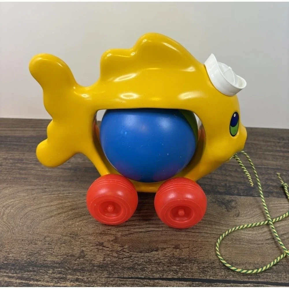 Vintage Pull Along Fish Toy Rolling Ball Rattle Plastic Sailor Hat